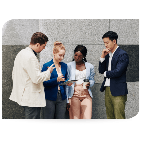 young professionals talking in front of an office building