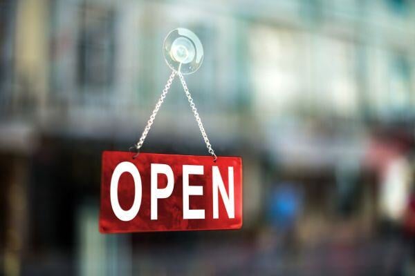open sign hanging in window